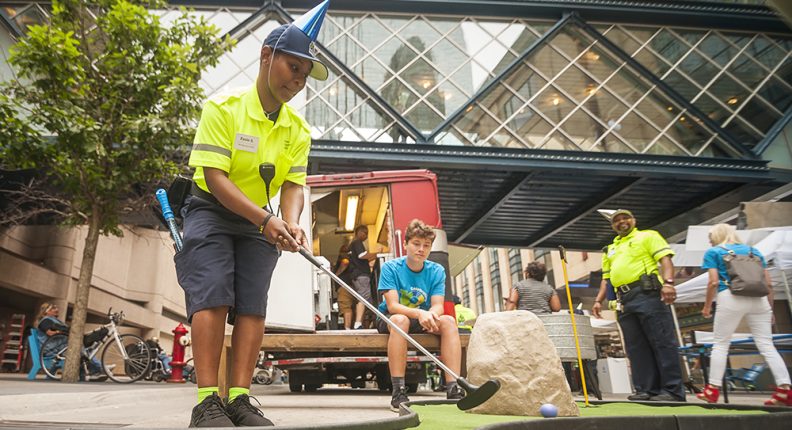 Mpls DID activating Nicollet Street with an ambassador playing mini-golf.
